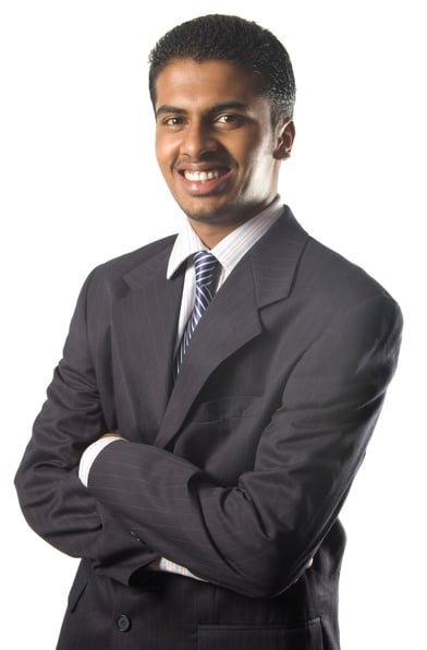 Indian business man in suit smiling